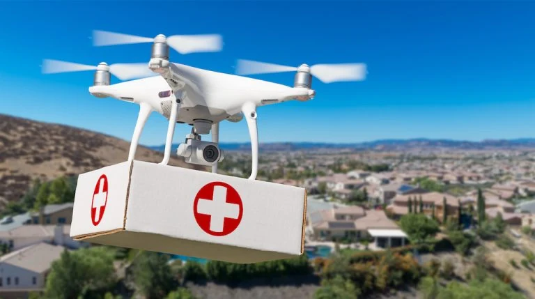 A fixed-wing delivery drone launching to carry medical supplies over rural terrain