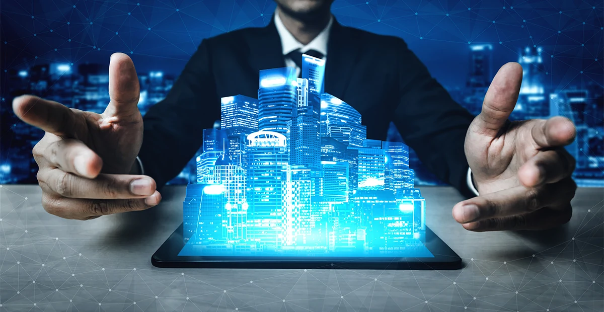 A person browsing property listings on a laptop with apartment buildings in the background