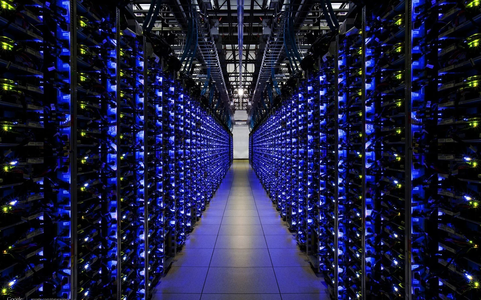Rows of server racks inside a modern data centre